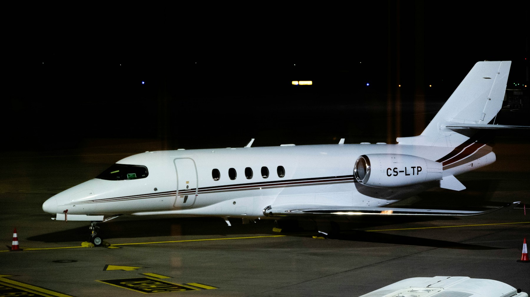 Private aircraft on runway at night